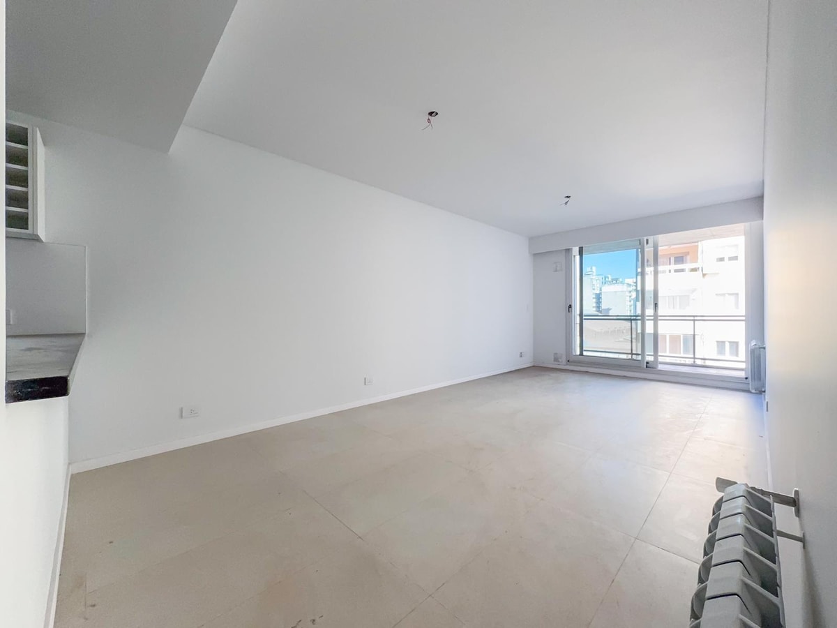 Departamento 2 dormitorios, estrenar, cochera, zona rio, radiadores, amenities — foto 1 de 22